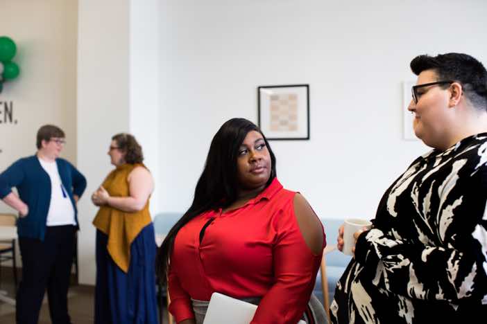 Women having a conversation in the office